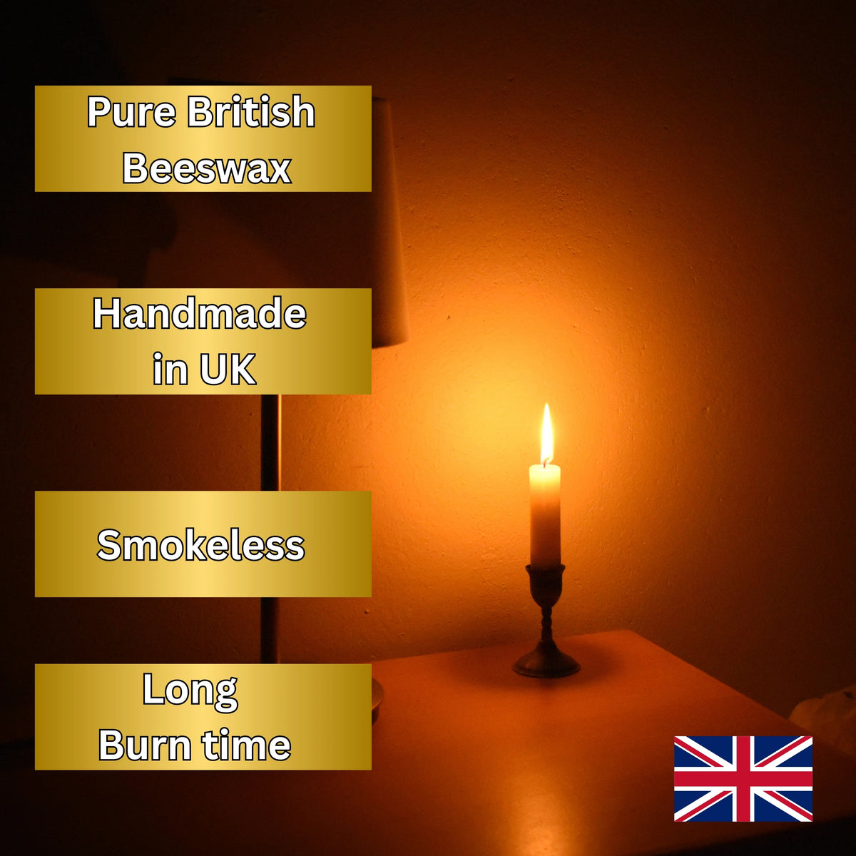 A lit candle in a dark holder on a table, casting a warm orange glow against a dark wall. Text overlays on the left read 'Pure British Beeswax', 'Handmade in UK', 'Smokeless', and 'Long Burn time', with a small Union Jack flag in the bottom right corner.