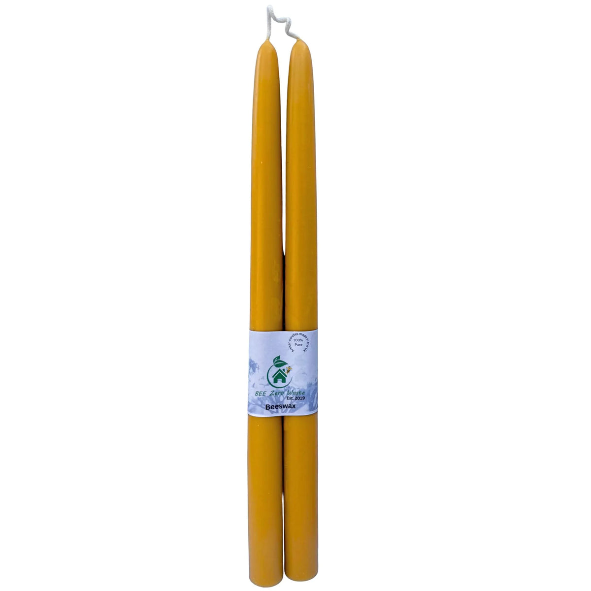 Two tall, yellow beeswax taper candles standing upright side-by-side, with a white paper label wrapped around the middle, on a plain white background.