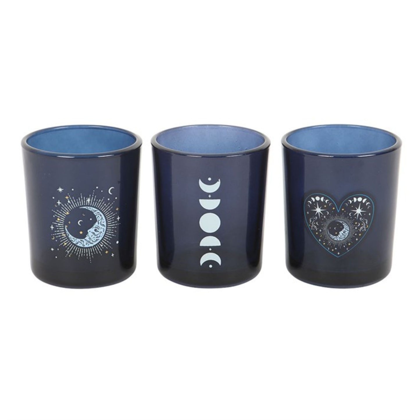 A set of 3 cobalt blue glass votive holders with intricate silver astrology prints, perfect for spiritual home decor.
