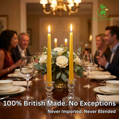Artisan hand-dipped beeswax dinner candles illuminating a dark romantic dining table setting